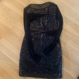 ASOS size 12 black sequin dress with see through arms, sides and back.